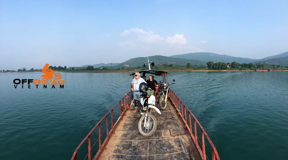 Top of page Vietnam Off-road Motorbike Tours - Ha Giang In 8 Days with a ferry crossing a river