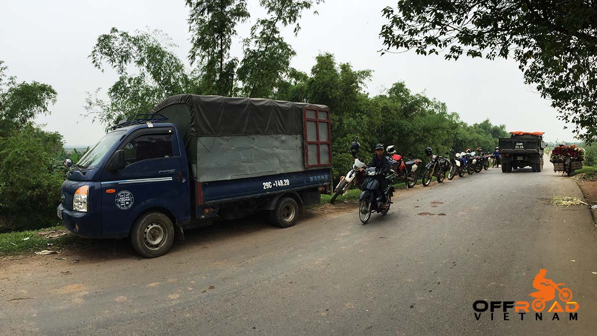 Support truck, back-up Huyndai truck and driver on a Vietnam motorcycle tour